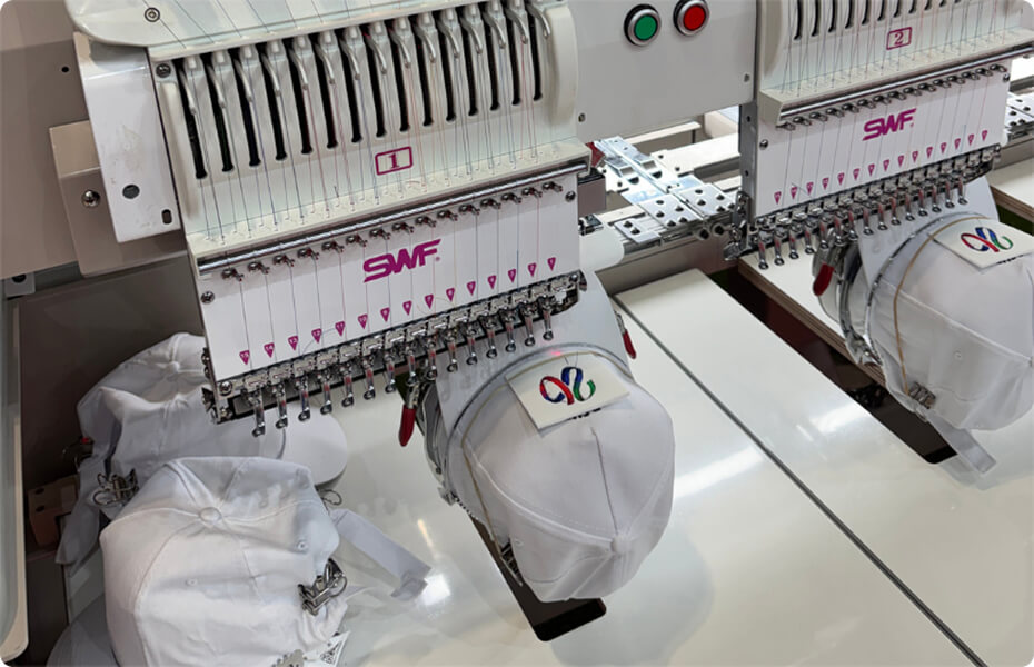 SWF embroidery machine stitching white caps for World Cup-inspired headwear